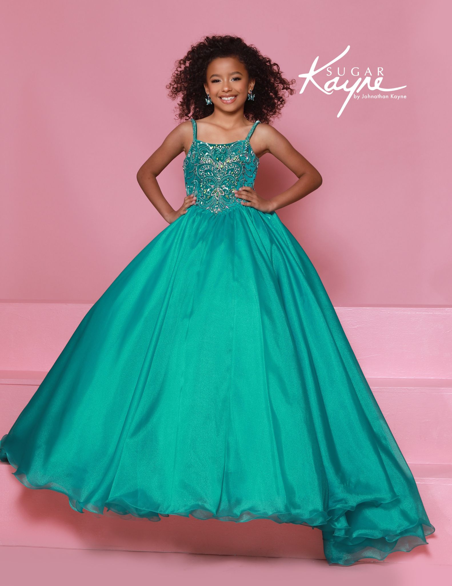 Little girls spaghetti strap teal ball gown with crystal beading, stunning choice for state pageants.